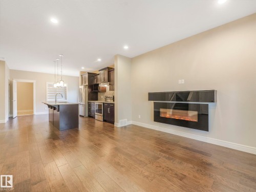 2 10319 120 Street, Edmonton, AB - Indoor Photo Showing Living Room With Fireplace