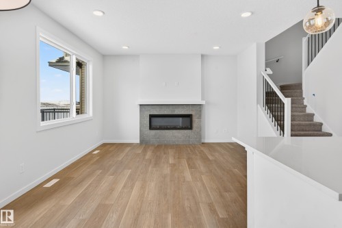 5008 72 Street, Beaumont, AB - Indoor Photo Showing Living Room With Fireplace
