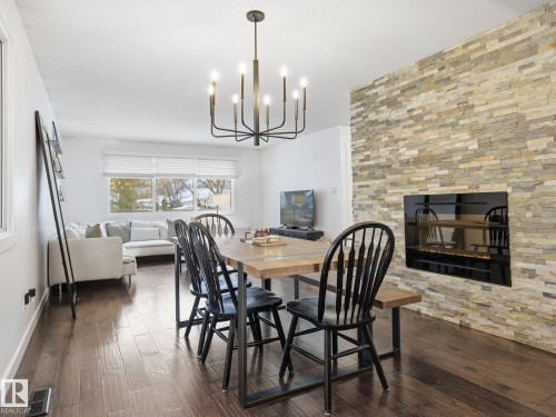 11 Leddy Avenue, St. Albert, AB - Indoor Photo Showing Dining Room With Fireplace