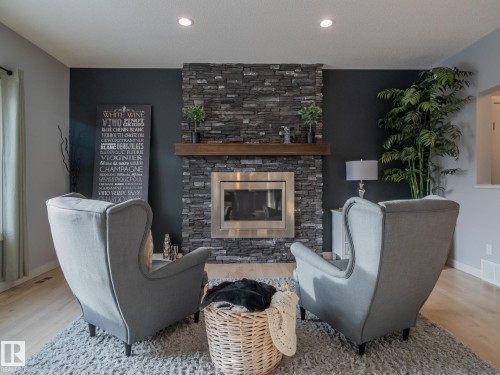 4211 Charles Close, Edmonton, AB - Indoor Photo Showing Living Room With Fireplace