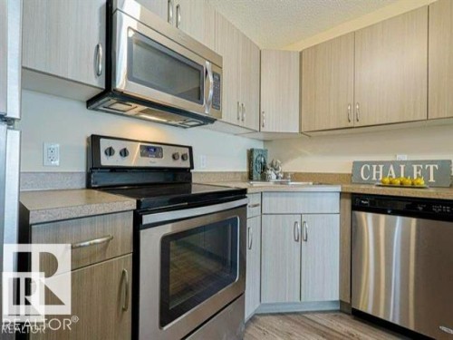 443 301 Clareview Station Drive Nw, Edmonton, AB - Indoor Photo Showing Kitchen With Stainless Steel Kitchen
