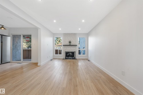 6030 Mill Woods Road S, Edmonton, AB - Indoor Photo Showing Living Room With Fireplace
