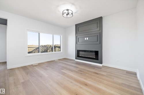 28 Chartres, St. Albert, AB - Indoor Photo Showing Living Room With Fireplace