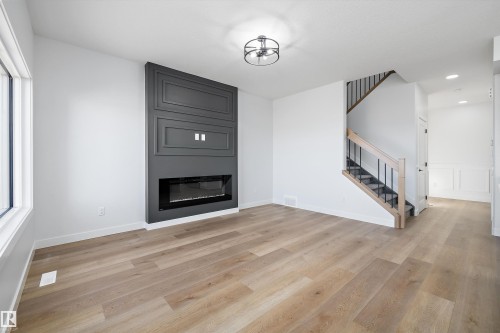 28 Chartres, St. Albert, AB - Indoor Photo Showing Living Room With Fireplace
