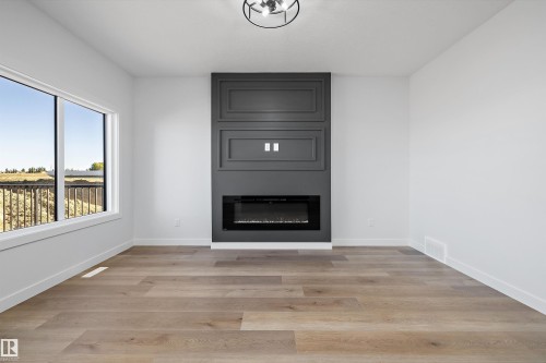 28 Chartres, St. Albert, AB - Indoor Photo Showing Other Room With Fireplace