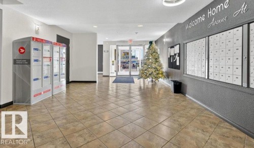 View of community lobby - 231 1180 Hyndman Road, Edmonton, AB - Indoor Photo Showing Other Room