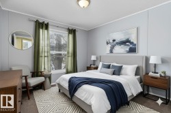 Bedroom with carpet, a textured ceiling, and crown molding - 