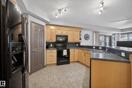 102 9803 96A Street, Edmonton, AB - Indoor Photo Showing Kitchen With Double Sink