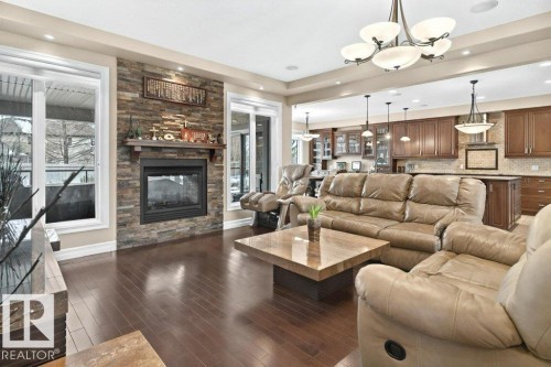 4835 Mactaggart Crest Crest, Edmonton, AB - Indoor Photo Showing Living Room With Fireplace