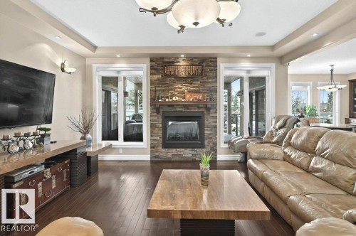 4835 Mactaggart Crest Crest, Edmonton, AB - Indoor Photo Showing Living Room With Fireplace