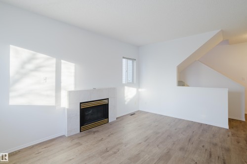 57 843 Youville Drive W, Edmonton, AB - Indoor Photo Showing Living Room With Fireplace