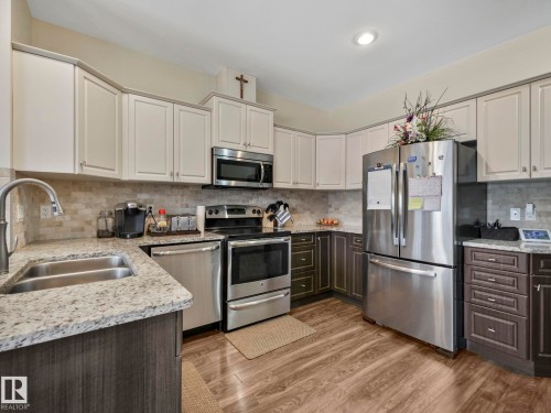 16 3103 Hilton Drive, Edmonton, AB - Indoor Photo Showing Kitchen With Double Sink
