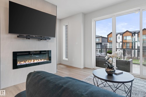 3284 Keswick Way, Edmonton, AB - Indoor Photo Showing Living Room With Fireplace