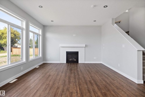 72 Maple Crescent, Gibbons, AB - Indoor Photo Showing Living Room With Fireplace