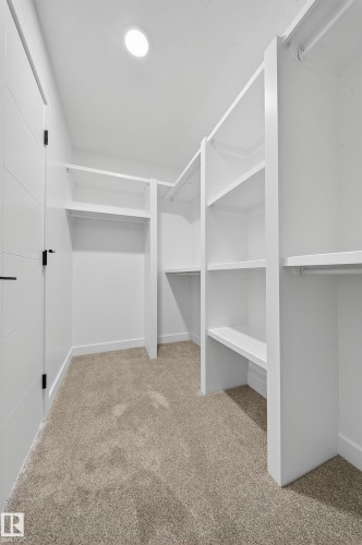 Spacious closet featuring light carpet - 3285 Chernowski Way Sw, Edmonton, AB - Indoor With Storage