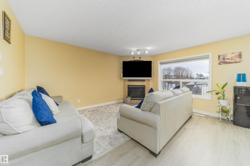 8518 6 Av, Edmonton, AB - Indoor Photo Showing Living Room With Fireplace
