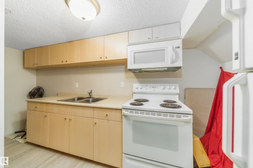 8518 6 Av, Edmonton, AB - Indoor Photo Showing Kitchen With Double Sink