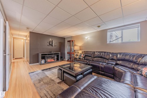 7808 163 Avenue, Edmonton, AB - Indoor Photo Showing Living Room With Fireplace