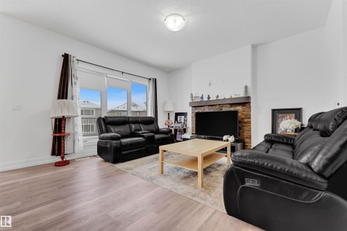 4231 Charles Close, Edmonton, AB - Indoor Photo Showing Living Room With Fireplace