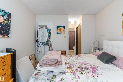 Bedroom featuring a closet and a textured ceiling - 305 32 Alpine Place, St. Albert, AB - Indoor Photo Showing Bedroom