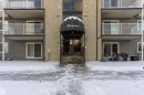 Snow covered building with a view of apartment building / complex - 305 32 Alpine Place, St. Albert, AB  - Outdoor 