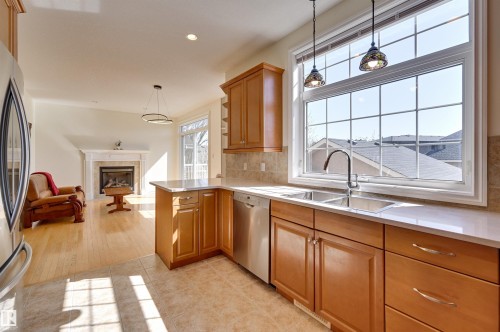 11729 71A Avenue, Edmonton, AB - Indoor Photo Showing Kitchen With Fireplace With Double Sink