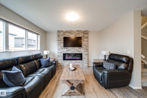 9040 Cooper Link, Edmonton, AB - Indoor Photo Showing Living Room With Fireplace