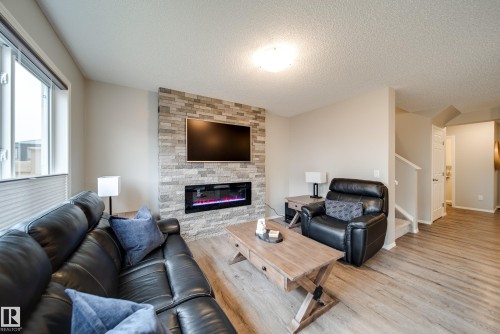 9040 Cooper Link, Edmonton, AB - Indoor Photo Showing Living Room With Fireplace