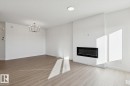 19027 20 Avenue, Edmonton, AB  - Indoor Photo Showing Living Room With Fireplace 