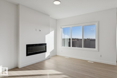 19027 20 Avenue, Edmonton, AB - Indoor Photo Showing Living Room With Fireplace