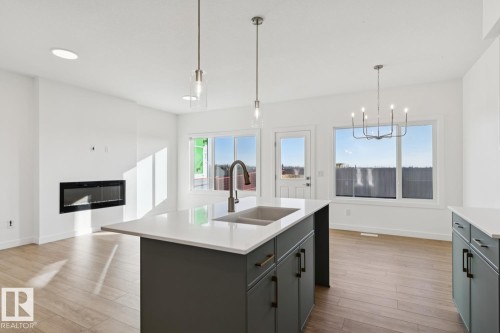 19043 20 Avenue, Edmonton, AB - Indoor Photo Showing Kitchen With Fireplace With Double Sink With Upgraded Kitchen