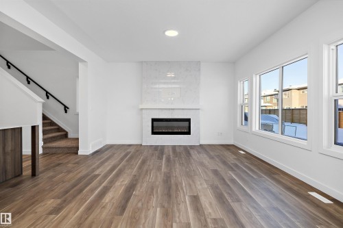 17325 6A Street, Edmonton, AB - Indoor Photo Showing Living Room With Fireplace