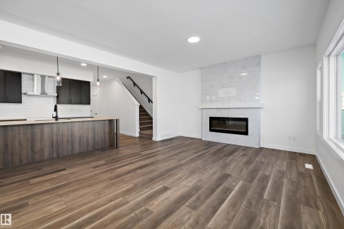 17325 6A Street, Edmonton, AB - Indoor Photo Showing Living Room With Fireplace