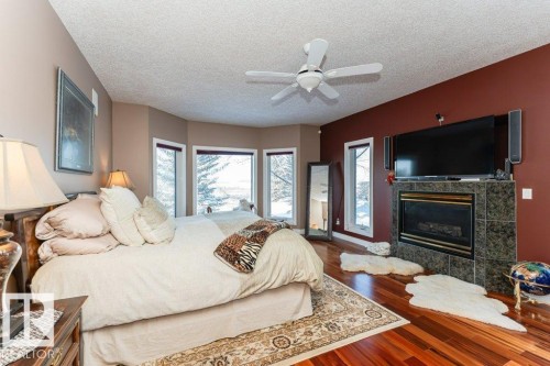 9610 167 Street Sw, Edmonton, AB - Indoor Photo Showing Bedroom With Fireplace