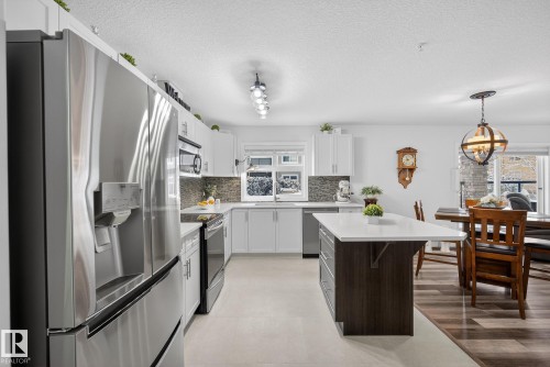 134 11505 Ellerslie Road, Edmonton, AB - Indoor Photo Showing Kitchen With Double Sink