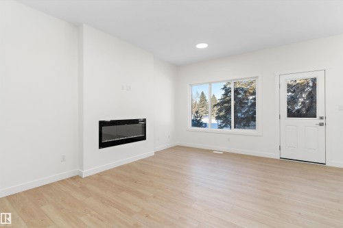 20708 43 Avenue, Edmonton, AB - Indoor Photo Showing Living Room With Fireplace