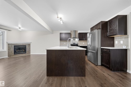 4216 Alexander Bay, Edmonton, AB - Indoor Photo Showing Kitchen With Fireplace