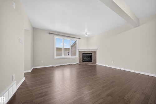 4216 Alexander Bay, Edmonton, AB - Indoor Photo Showing Living Room With Fireplace