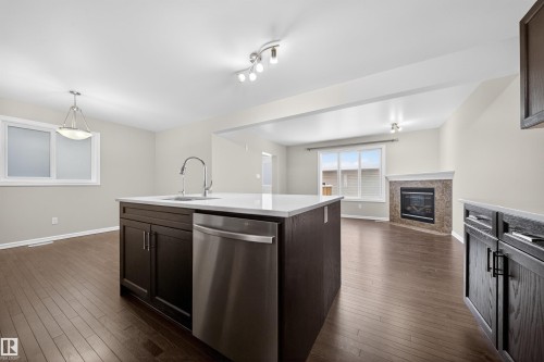 4216 Alexander Bay, Edmonton, AB - Indoor Photo Showing Kitchen With Fireplace