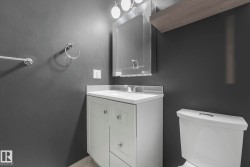 Bathroom with vanity and toilet - 