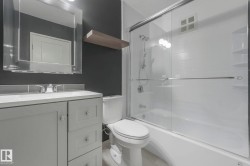 Full bathroom with vanity and combined bath / shower with glass door - 