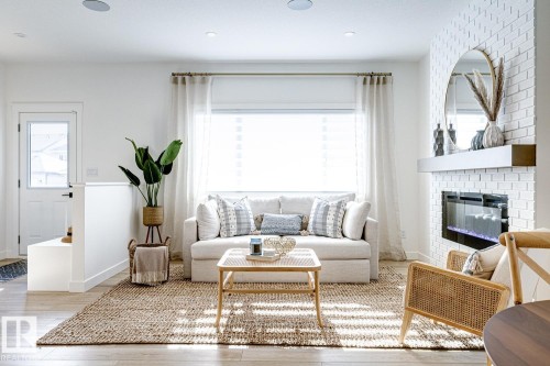 301 Juniper Cove, Leduc, AB - Indoor Photo Showing Living Room With Fireplace