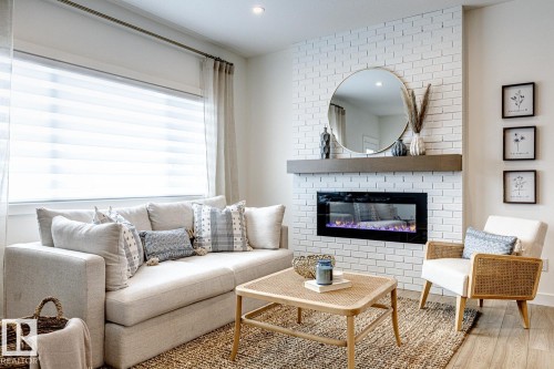 301 Juniper Cove, Leduc, AB - Indoor Photo Showing Living Room With Fireplace