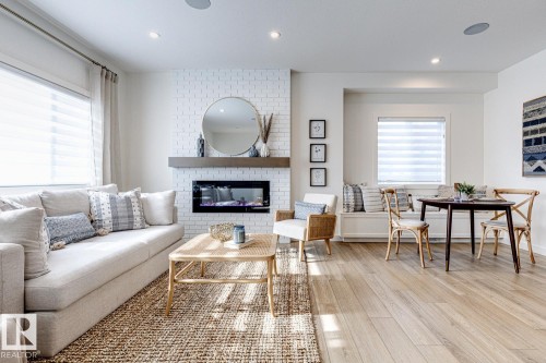 301 Juniper Cove, Leduc, AB - Indoor Photo Showing Living Room With Fireplace