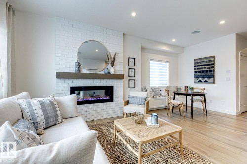 301 Juniper Cove, Leduc, AB - Indoor Photo Showing Living Room With Fireplace