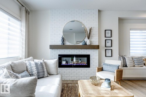 301 Juniper Cove, Leduc, AB - Indoor Photo Showing Living Room With Fireplace