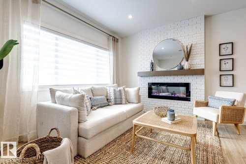 301 Juniper Cove, Leduc, AB - Indoor Photo Showing Living Room With Fireplace