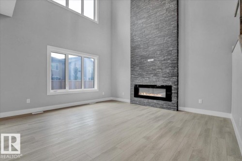 65 Blackbird Bend, Fort Saskatchewan, AB - Indoor Photo Showing Living Room With Fireplace