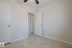 Unfurnished bedroom with a ceiling fan and light floors - 