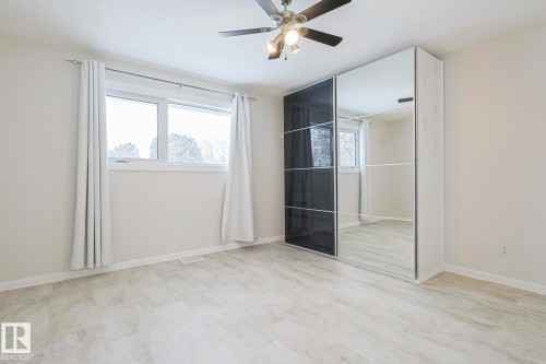 Unfurnished bedroom featuring a closet and a ceiling fan - 13419 102 Street, Edmonton, AB - Indoor Photo Showing Other Room
